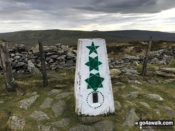 The trig point on the summit of Calf Top