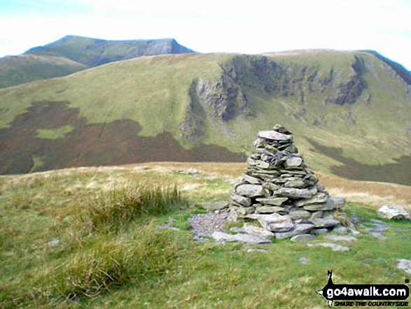 Walk c191 The Glendermackin Round from Mungrisdale - Souther Fell summit cairn with Blencathra (or Saddleback) (distance) and Bannerdale Crags in the background