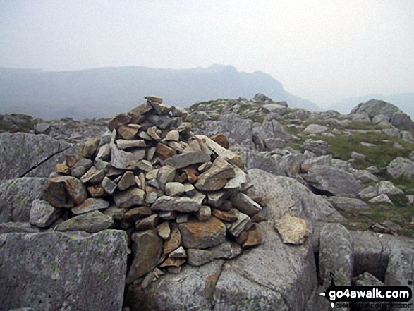 Walk c416 Scafell Pike from The Old Dungeon Ghyll, Great Langdale - Rossett Pike summit cairn with The Langdale Pikes in the distance