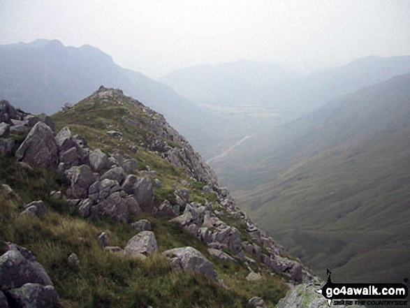 Rossett Pike summit ridge with The Langdale Pikes in the distance and Great Langdale far below