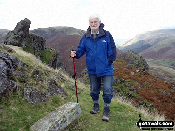 Walk c302 High Raise via Calf Crag from Grasmere - My husband Eric on Helm Crag