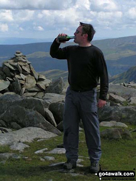 Paul Barker (and a bottle of Port) on Helvellyn in The Lake District Cumbria England