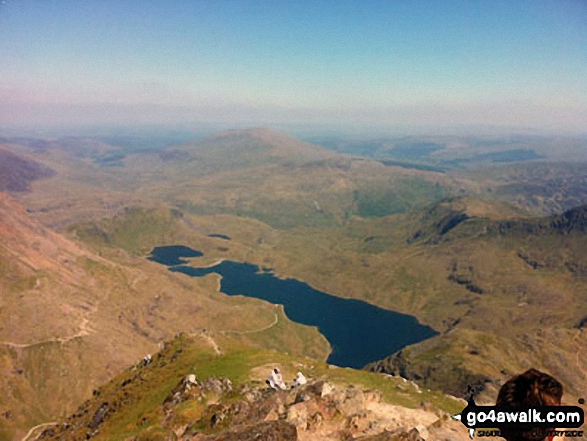 Walk gw117 Snowdon and Yr Aran via The Watkin Path from Bathania, Nantgwynant - The awe inspiring view from Snowdon's summit featuring Llyn Llydaw with Carnedd Moel Siabod beyond