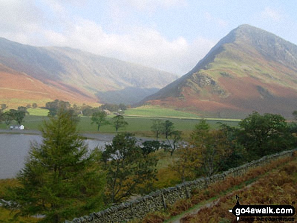 Walk c367 Robinson and High Snockrigg from Buttermere - Autumn sunshine on Dale Head (left) and Fleetwith Pike (right) from Burtness Wood