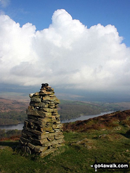 Looking northwest across Brock Barrow's second cairn to the Coniston and Furness Fells hidden beneath towering cumulus 