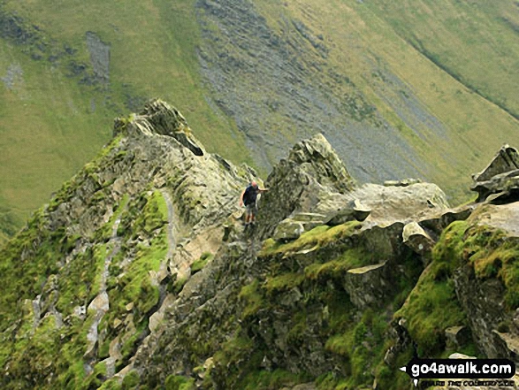 Walk c191 The Glendermackin Round from Mungrisdale - A walker negotiates the 'awkward place' on Sharp Edge