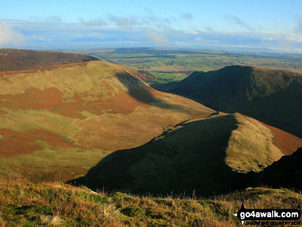 Walk c191 The Glendermackin Round from Mungrisdale - Bannerdale from between The Tongue and the sunlit east ridge of Bannerdale Crags