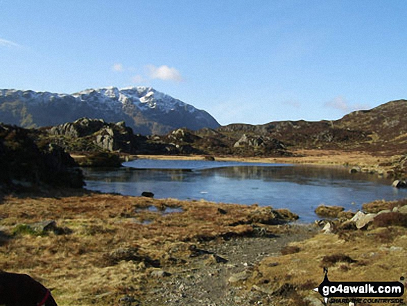 Walk c228 Hay Stacks from Buttermere - Innominate Tarn (Hay Stacks) with a snow-capped Pillar beyond