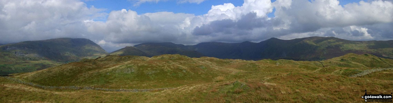 Walk c412 Wansfell Pike and Baystones (Wansfell) from Ambleside - *Baystones (Wansfell) in the foreground with Red Screes (left), Stony Cove Pike (Caudale Moor), Thornthwaite Crag and the Froswick, Ill Bell, Yoke ridge silhouetted on the skyline from Wansfell Pike