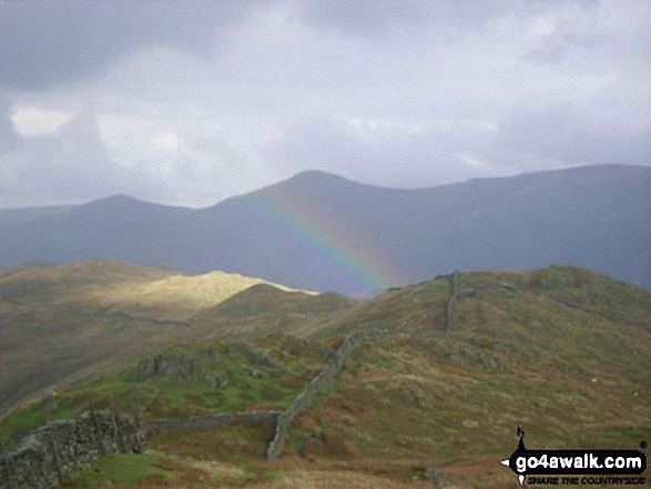 Walk c412 Wansfell Pike and Baystones (Wansfell) from Ambleside - Looking north to Baystones with Thornthwaite Crag (left) and Ill Bell (centre) beyond from Wansfell Pike as the sun catches a passing shower