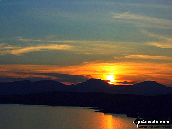 The setting sun behind Macleod's Tables (Healabhal Mhor (Macleod's Table North) and Healabhal Beag (Macleod's Table South) 