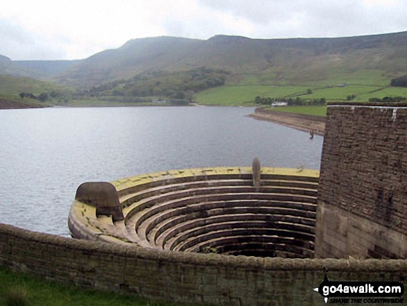 Dove Stone Reservoir overflow with Great Dove Stone Rocks in the background 