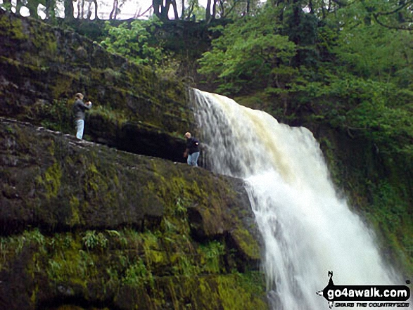 Walk po141 The Waterfalls Walk from Pontneddfechan - Two guys taking a chance at Sgwd yr Elra Waterfall, Afon Mellte in the background