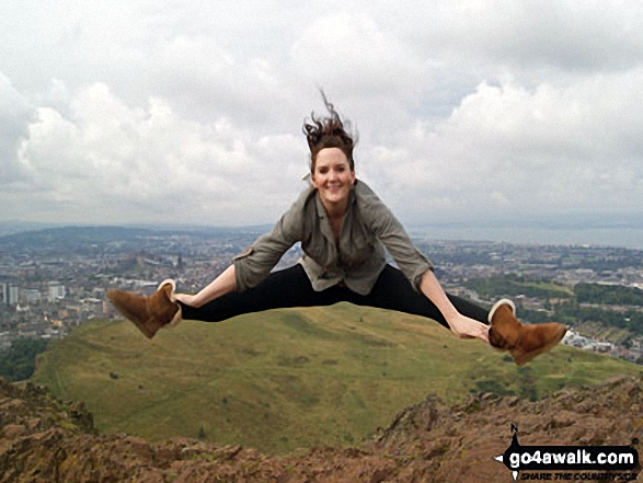 Me jumping for joy at the great view from at Arthur's Seat, Edinburgh, with Edinburgh Castle in the background 