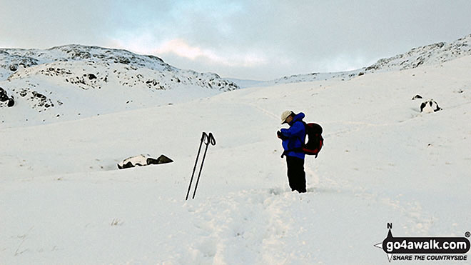 Walk c301 Glaramara and Allen Crags from Seatoller (Borrowdale) - Checking the GPS on Sty Head in the snow