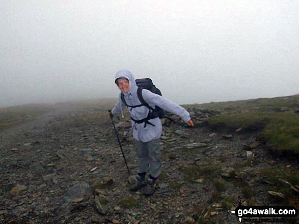 Walk gw152 Cadair Idris (Penygadair), Mynydd Moel, Cyfrwy and Gau Craig via The Pony Path - Ann on a windy climb up Cadair Idris (Penygadair) -  should have chosen a better day