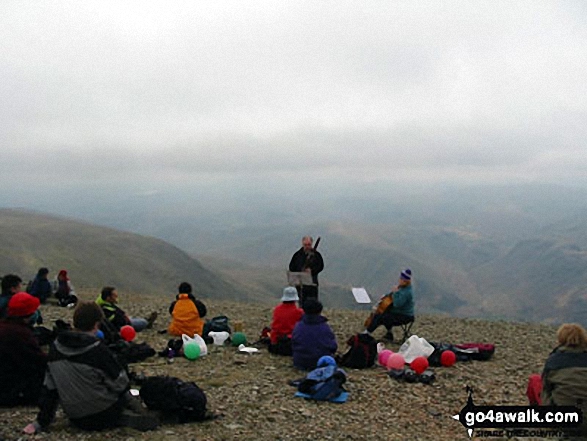 Walk c427 Helvellyn via Striding Edge from Patterdale - Musicians on the summit of Helvellyn