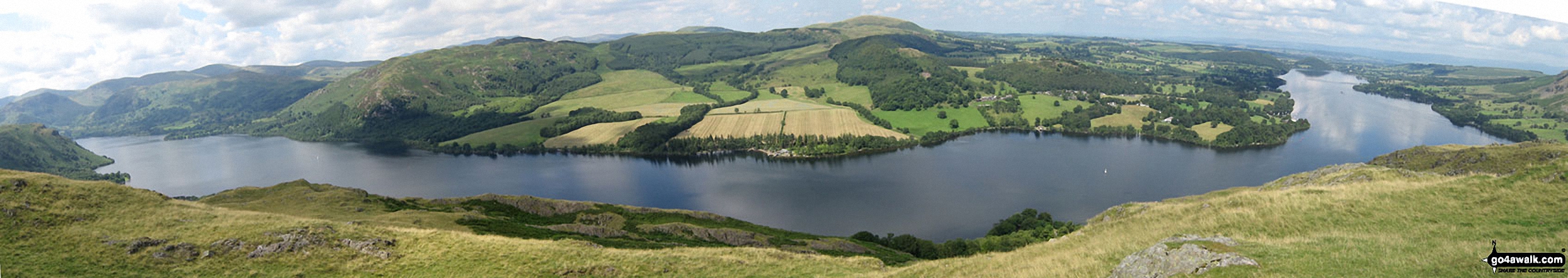 Ullswater featuring Patterdale & Glenridding (left), Gowbarrow Fell (Airy Crag) (centre left), Great Mell Fell (centre), Little Mell Fell (centre right) and Pooley Bridge (right) from Hallin Fell summit