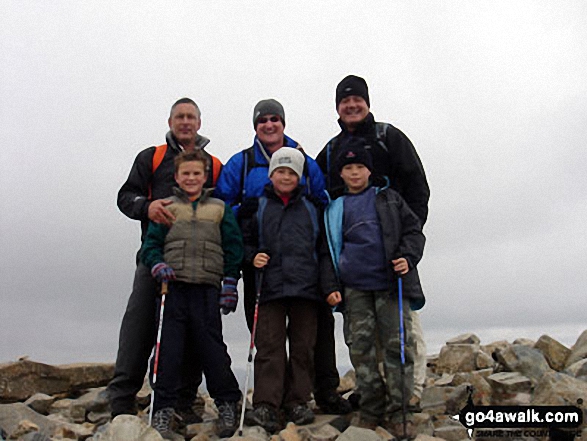 Walk c172 Scafell Pike via The Corridor Route from Wasdale Head, Wast Water - Father and Sons on top of Scafell Pike