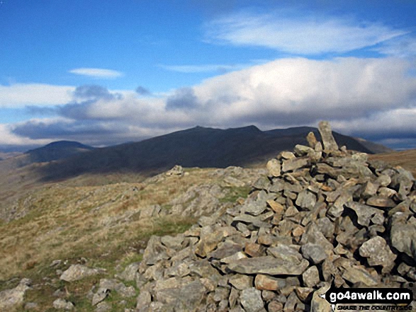 White Maiden summit cairn with Grey Friar (left), Dow Crag, Brown Pike and The Old Man of Coniston (right) in the background