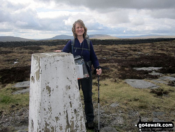 Standing beside the summit trig point on Firth Fell 