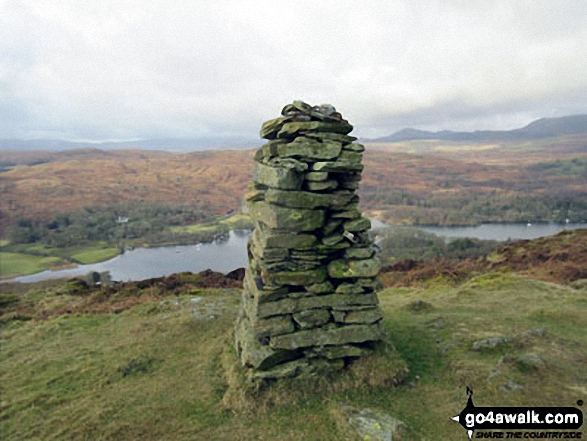 Brock Barrow (Top o' Selside) summit cairn with Coniston Water below 