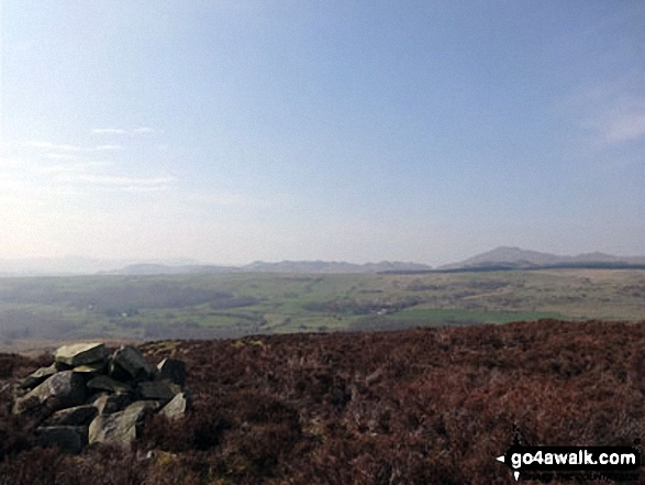 A cairn on Yew Bank (Blawith Fells) with Harter Fell (Eskdale) in the distance (right)