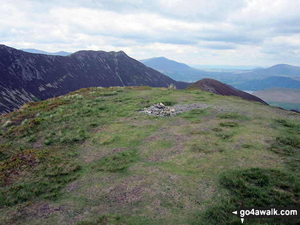 The summit of Ard Crags with the shoulder of Robinson and High Snockrigg beyond 