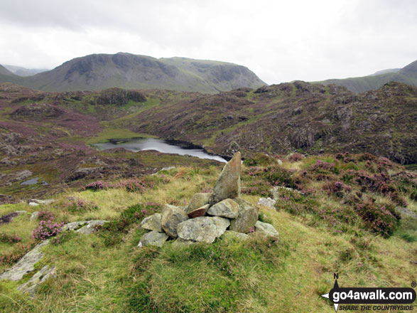 Green Crag (Buttermere) summit cairn with Kirk Fell beyond 