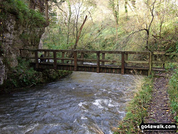 Walk d173 Chelmorton from Wye Dale - The Monsal Trail crossing a footbridge over The River Wye in Chee Dale