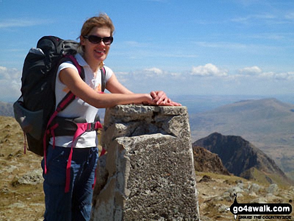 Clare on the summit of Garnedd Ugain (Crib y Ddysgl) with Crib Goch in the background (bottom right)