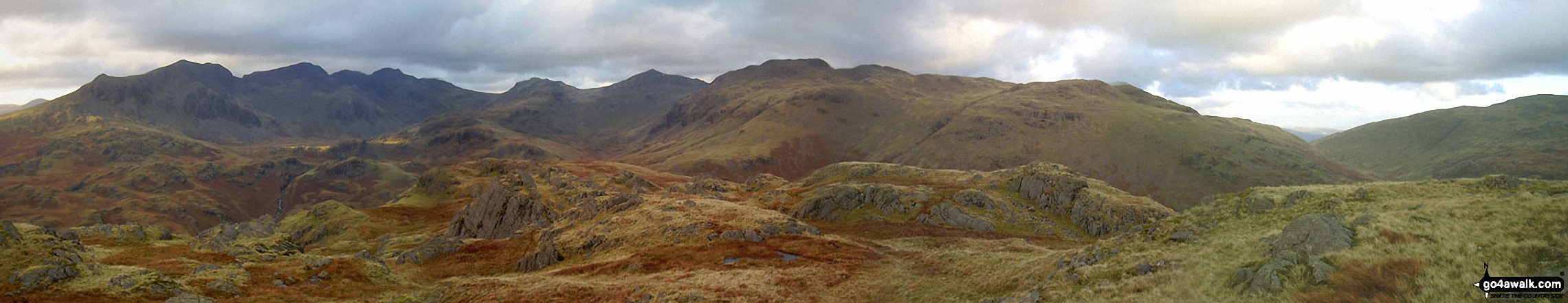 Walk c402 Harter Fell and Hard Knott from The Woolpack Inn, Eskdale - From left to right: Slight Side and Sca Fell, Mickledore, Scafell Pike, Ill Crag and Great End, Esk Hause, Esk Pike, Bow Fell (Bowfell), Crinkle Crags (Long Top), Cold Pike, Little Stand and finally the shoulder of Grey Friar from the summit of Hard Knott