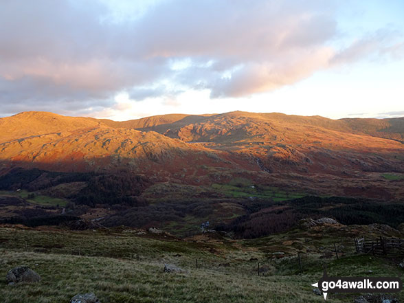 Walk c402 Harter Fell and Hard Knott from The Woolpack Inn, Eskdale - Sun setting in the Duddon Valley and the Seathwaite Fells (Dow Crag, Brown Pike & Walna Scar) from the path up Harter Fell (Eskdale)