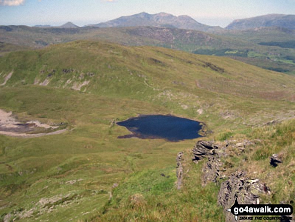 Llynnau Barlwyd (foreground), Moel Farlwyd (midground left), Yr Aran (pointed peak above Moel Farlwyd), Mount Snowdon (Yr Wyddfa) & Y Lliwedd from Moel Penamnen