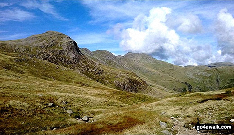 Great Knott, Crinkle Crags (South Top), Crinkle Crags (Long Top), Shelter Crags and Bow Fell from Browney Gill NB. In this photo the cloud formation above Bow Fell makes it look like it is erupting like a volcano!