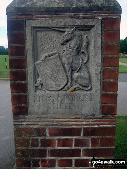 Carving on the gate post at the entrance to King George's Field, Yapton 