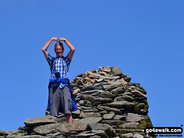 Doing the 'Mobot' on the summit of The Old Man of Coniston 