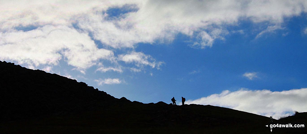 Walk ny130 Ingleborough and Raven Scar from The Old Hill Inn, Ribblehead - Walkers on Ingleborough