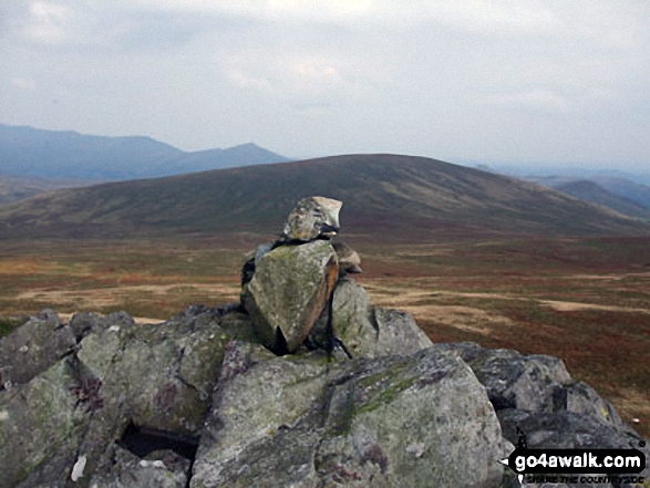 Yoadcastle summit cairn with Hesk Fell beyond 