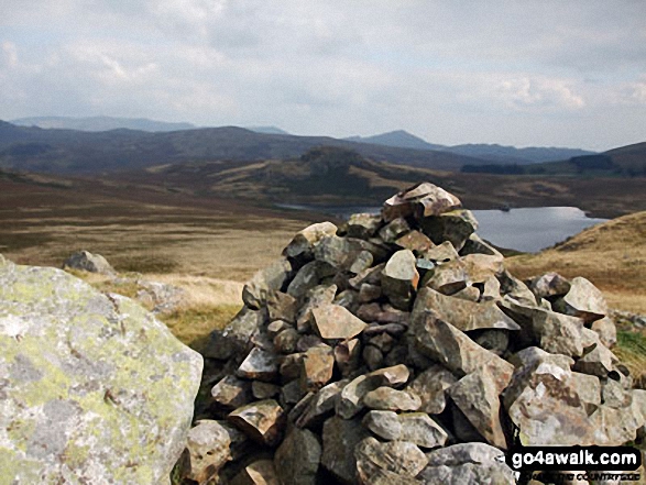 Water Crag (Birker Fell) summit cairn with Devoke Water beyond 