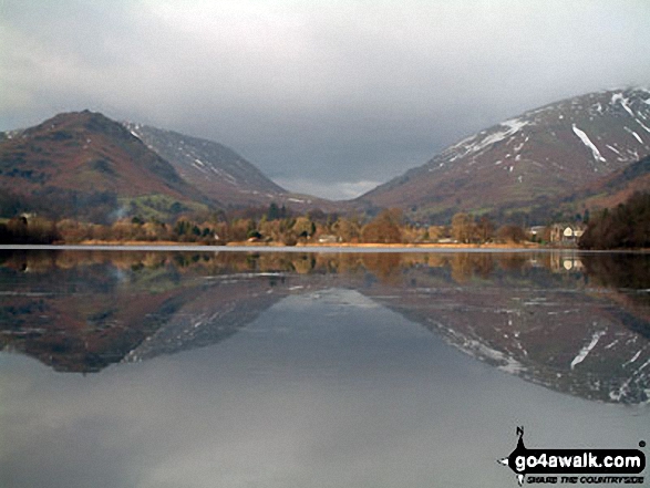 Helm Crag & Steel Fell (left), Grasmere Village & Dunmail Raise (centre) and Seat Sandal (right) beautifully reflected in Grasmere