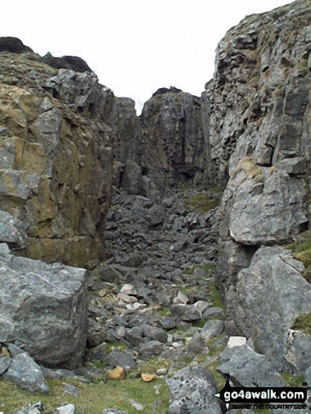 Walk ny130 Ingleborough and Raven Scar from The Old Hill Inn, Ribblehead - Entrance to Jingle Pot in Chapel-le-Dale