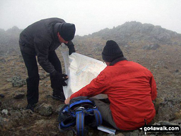 Me (in orange jacket) and my mate Neil on our way to the top of Helvellyn on a drizzly and bitterly cold day.