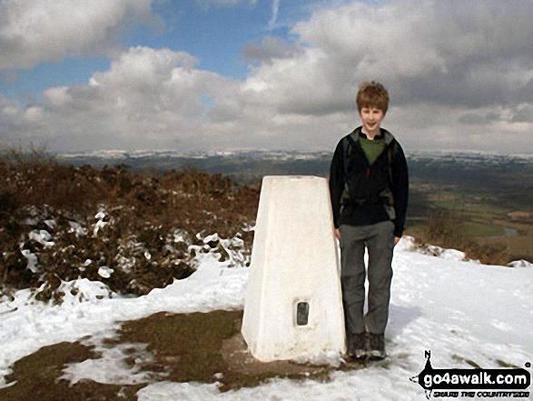 My son at Merbach Hill trig point with Hergest Ridge, Colva Hill and Glascwm Hill in the distance