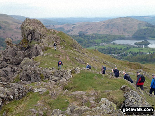 Walk c294 Steel Fell from Grasmere - Runaway Ramblers from Bury approach 'The Lion and the Lamb' on Helm Crag