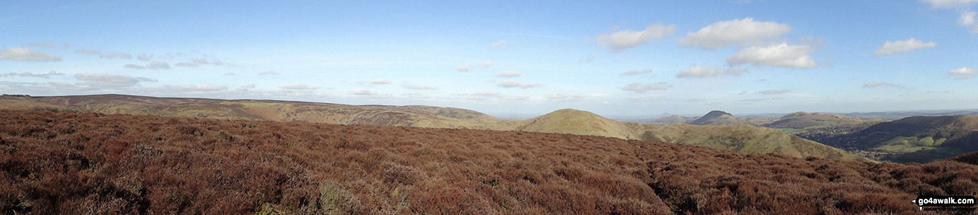 The Long Mynd (Pole Bank), Yearlet and Ashlet (mid-distance) with The Lawley (left), Caer Caradoc Hill, Church Stretton, Ragleth Hill (right) beyond from near Grindle above Ashes Hollow