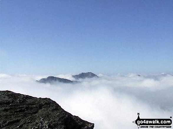 The summits of Ben Vane (left) and Beinn Ime poking up through the clouds during a temperature inversion seen from Ben Vorlich (The Arrochar Alps) 