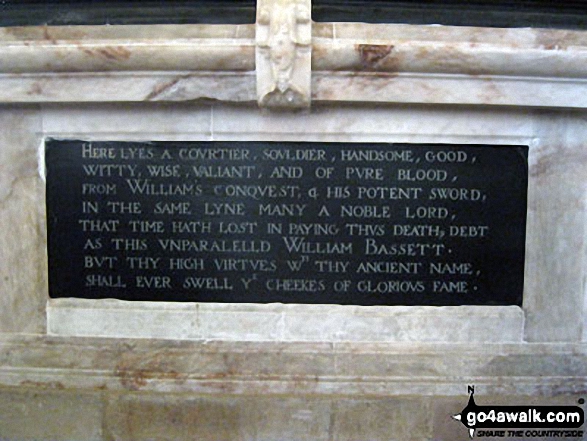 The Plaque beneath the Bassett Monument inside St. Bartholomew's Church, Blore The caption reads: Here lyes courtier, soldier, handsome, good, witty, wise, valiant, and of pure blood, from Williwam's conquest and his potent sword in the same lyne many a noble lord, that time hath lost in paying this death and debt as this unparalelld William Bassett but thy high virtues with thy ancient name, shall ever swell ye cheekes of glorious fame.