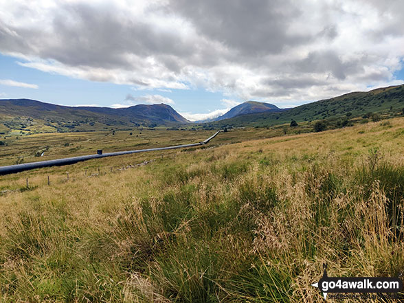 The Llyn Cowlyd Reservoir pipeline in Cwm Afon Ddu with Creigiau Gleision (left) & Pen Llithrig y Wrach (right) at the end of the valley