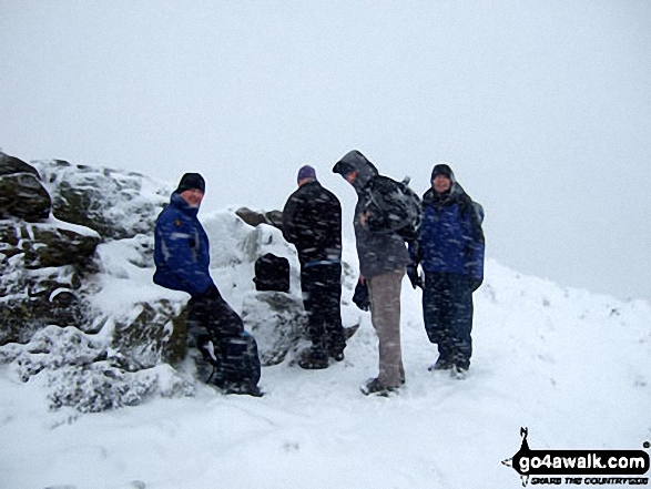 Walk d144 Winhill Pike (Win Hill) and Hope Cross from Yorkshire Bridge - Jimbles, Langy, Big Truck & Mozzer on the summit of Winhill Pike (Win Hill) during a blizzard